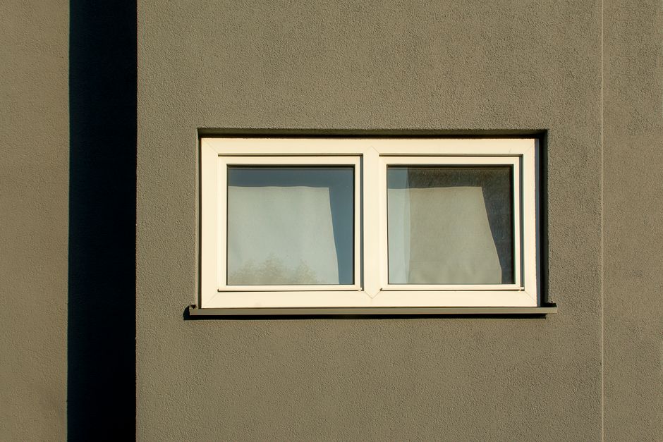 Clean white vinyl window frame close up
