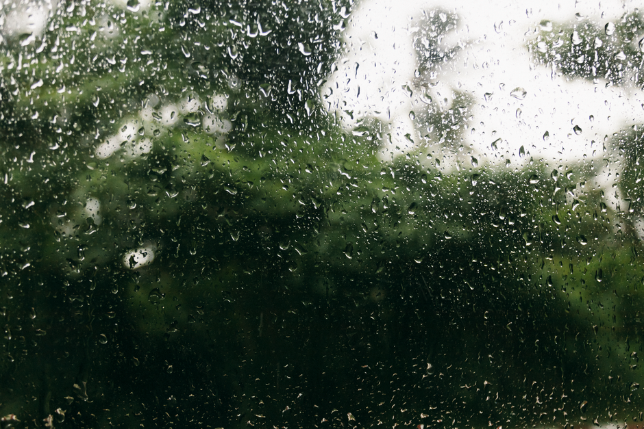 Rain drops on a highly insulated energy efficient window pane